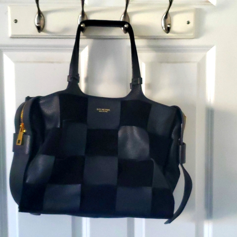 Like new, Lia Numa black leather and suede purse.